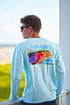 Man wearing Rainbow Trout UPF 50+ Shirt on a balcony, highlighting the artistic trout print and lightweight activewear fit.